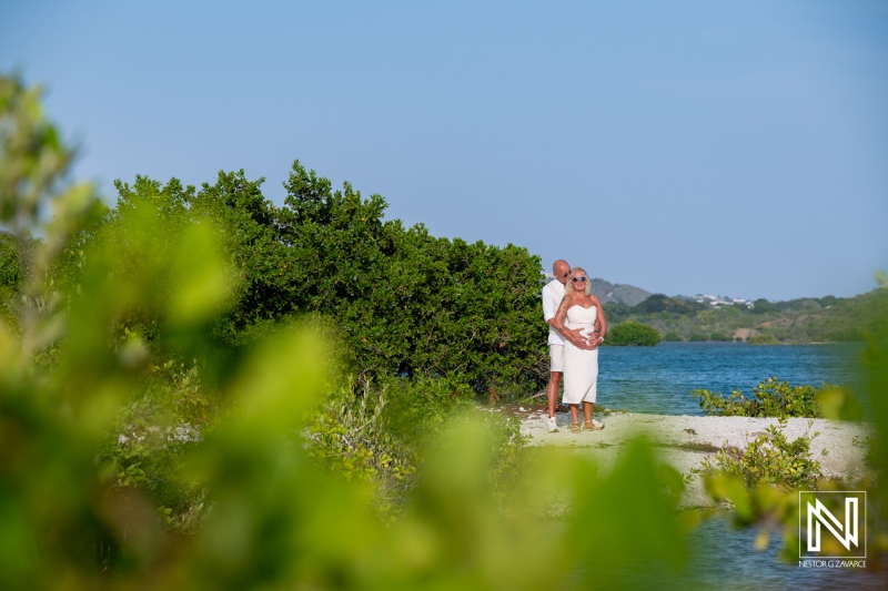 Couple enjoys wedding celebration at Daaibooi Beach in Curacao surrounded by nature