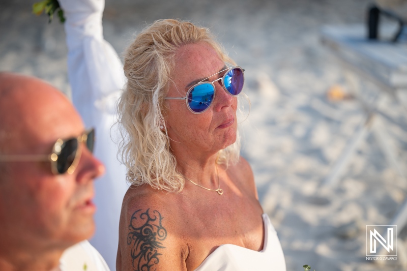 Wedding ceremony at Daaibooi Beach in Curacao with guests enjoying the moment