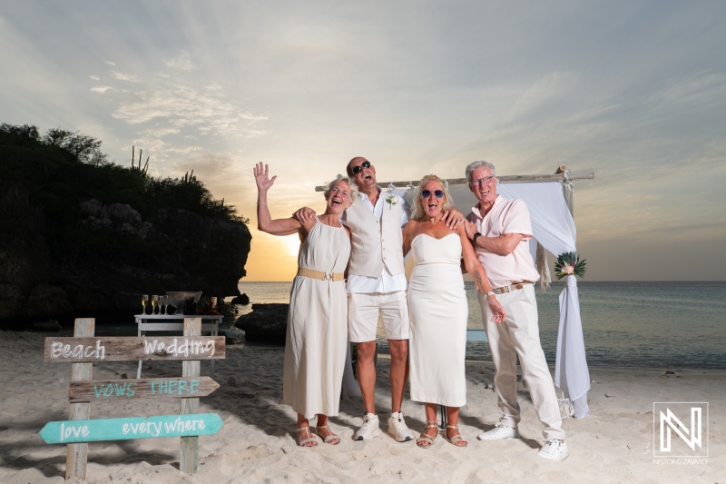 Wedding celebration at Daaibooi Beach in Curacao with family and friends enjoying the moment