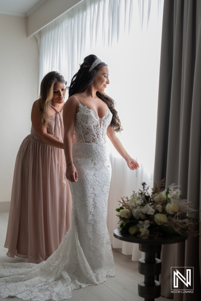 Bride getting into attire