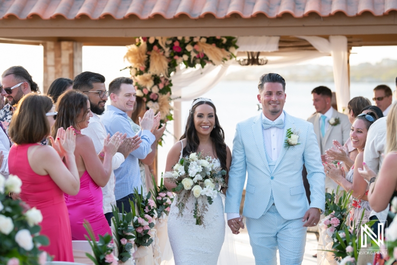 Bride and groom walking at the aisle