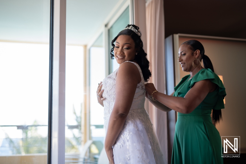 Bride getting into attire