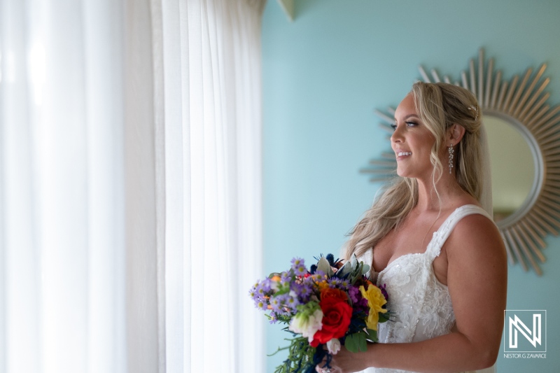 Couple prepares for wedding ceremony at Sunscape Curacao Resort with beautiful coastal views