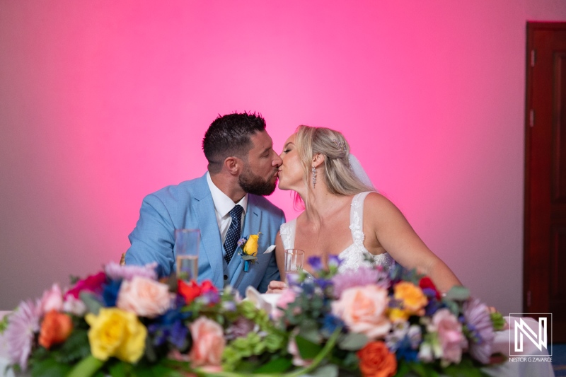 Couple sharing a romantic kiss during their wedding celebration at Sunscape Curacao Resort in Curacao