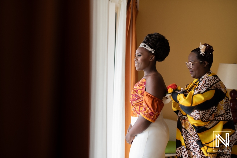 Bride getting into attire