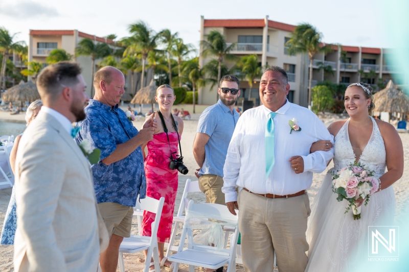 A Joyful Beach Wedding Ceremony Takes Place at Sunset With Family and Friends Celebrating the Couple\'s Special Day in a Tropical Paradise