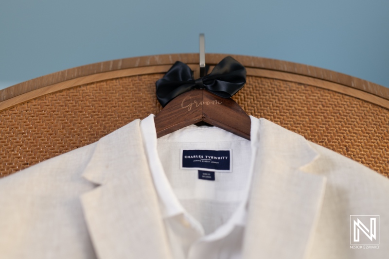 Elegant wedding attire preparation at Renaissance Wind Creek Curacao Resort during a beautiful sunset celebration