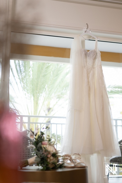 Beautiful wedding dress on display at Renaissance Wind Creek Curacao Resort during a romantic sunset celebration