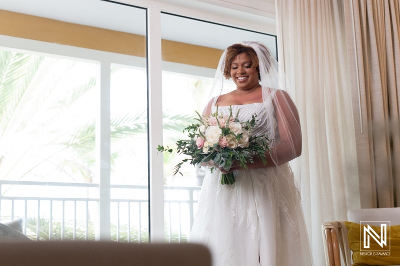 Elegant bride prepares for a romantic wedding at sunset in Curacao, capturing the beauty of love at a luxurious resort