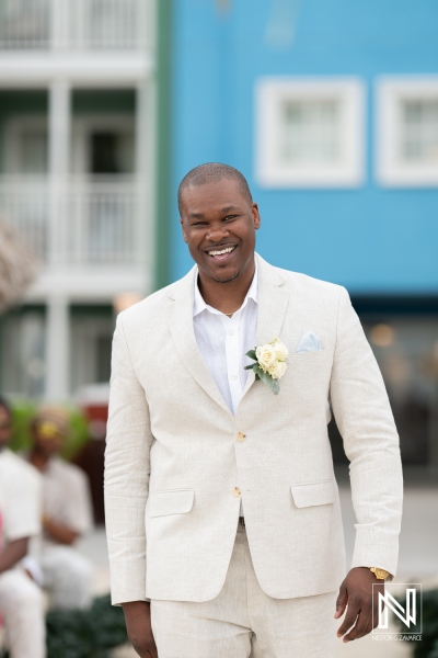 Groom walking towards altar at sunset wedding ceremony in Curacao at Renaissance Wind Creek Resort