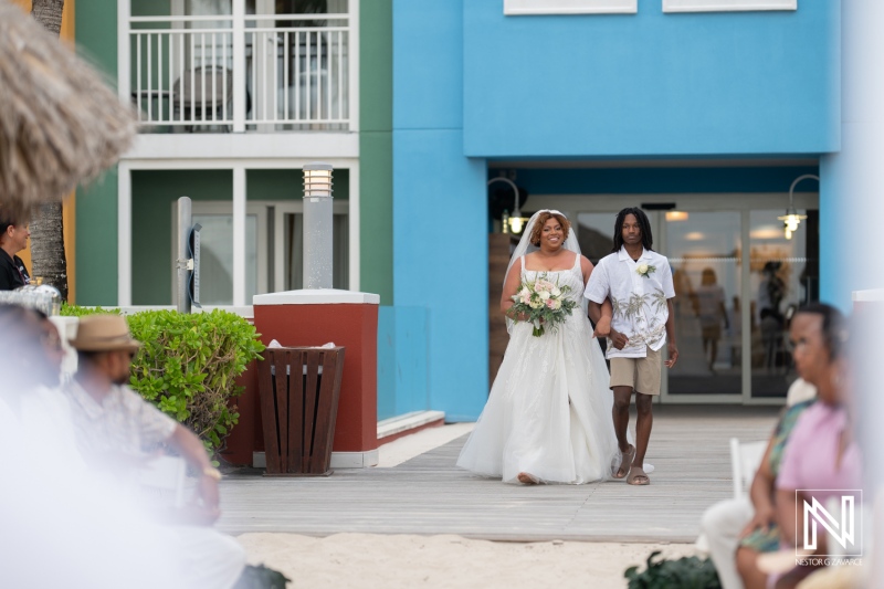 Wedding ceremony at sunset on the beach in Curacao, celebrating love at Renaissance Wind Creek Curacao Resort