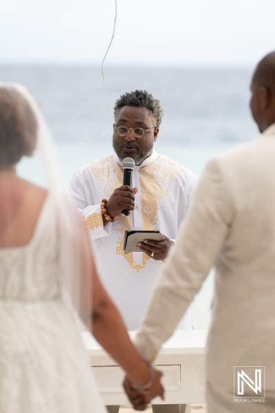 Romantic wedding ceremony at sunset in Curacao with vows exchanged by the couple
