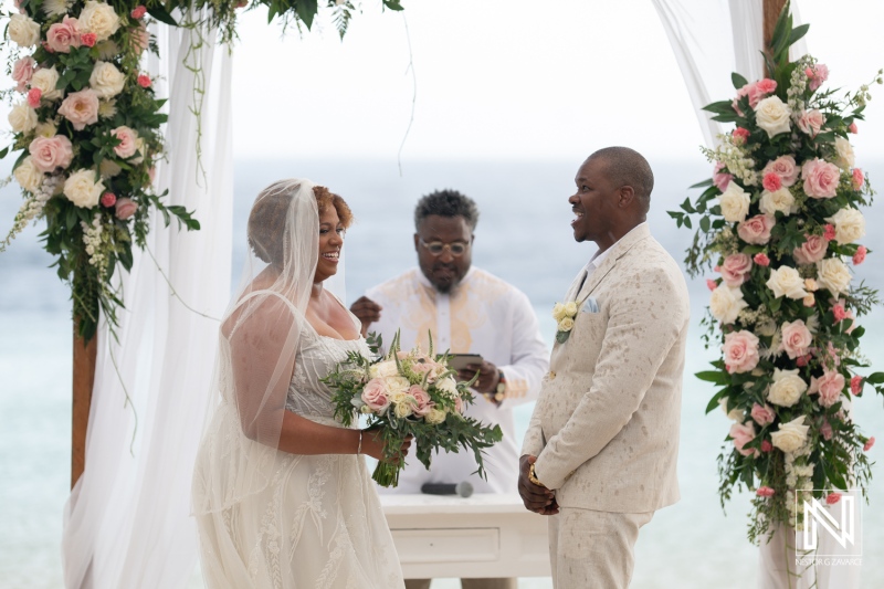 Couples exchange vows during romantic sunset wedding ceremony at Renaissance Wind Creek Curacao Resort