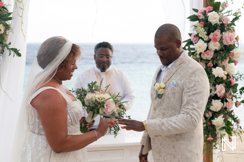 Joyful wedding ceremony at Renaissance Wind Creek Curacao Resort during a beautiful sunset by the ocean