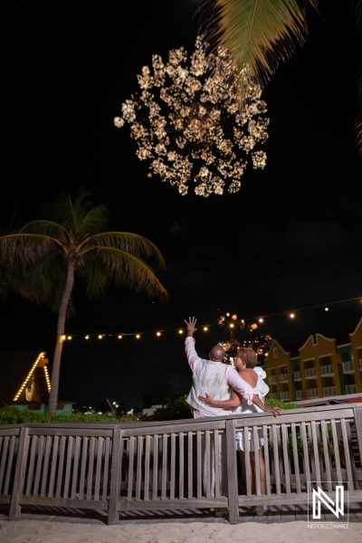 Couple celebrates their wedding under a beautiful sunset at Renaissance Wind Creek Curacao Resort