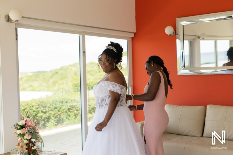 Bride getting into attire