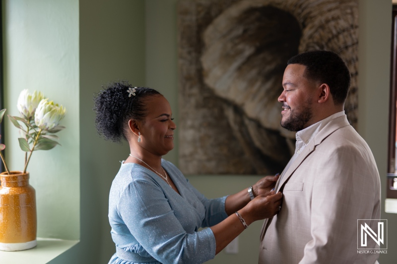 Couple prepares for their wedding ceremony at Playa Hunku in Curacao surrounded by love and excitement