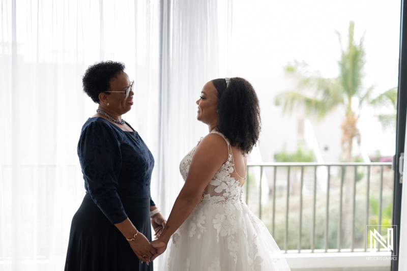 Cherished moments between a bride and her mother before the wedding ceremony in Playa Hunku, Curacao