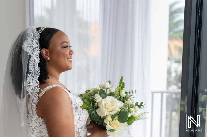 Joyful bride preparing for her wedding ceremony at Playa Hunku in Curacao surrounded by nature and love in the air