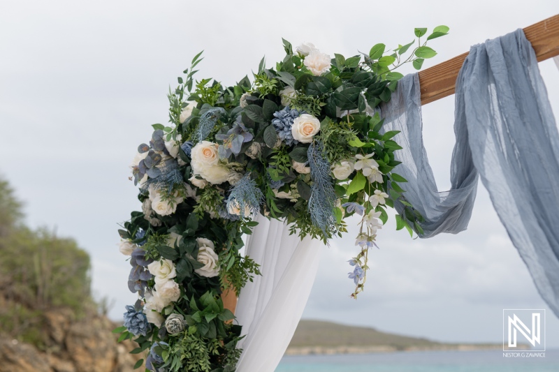 Beautiful floral arrangement at a wedding ceremony in Playa Hunku, Curacao, showcasing nature and elegance along the shoreline