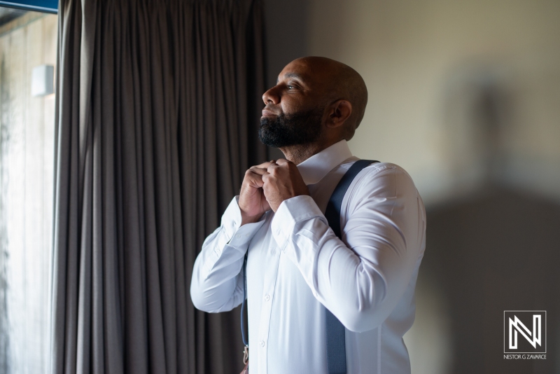 Groom getting dressed