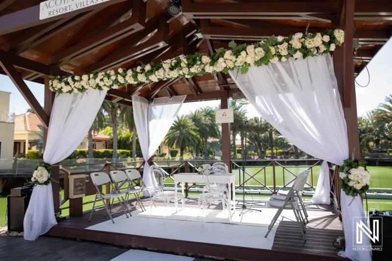 Beautiful wedding setup at Acoya Curacao Resort with floral decorations and a serene backdrop