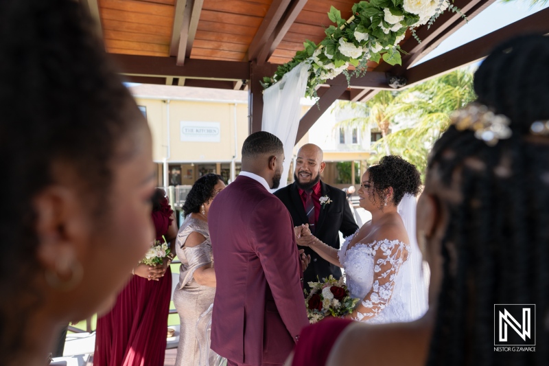 Couple exchanges vows during a beautiful wedding ceremony at Acoya Curacao Resort on a sunny day in paradise