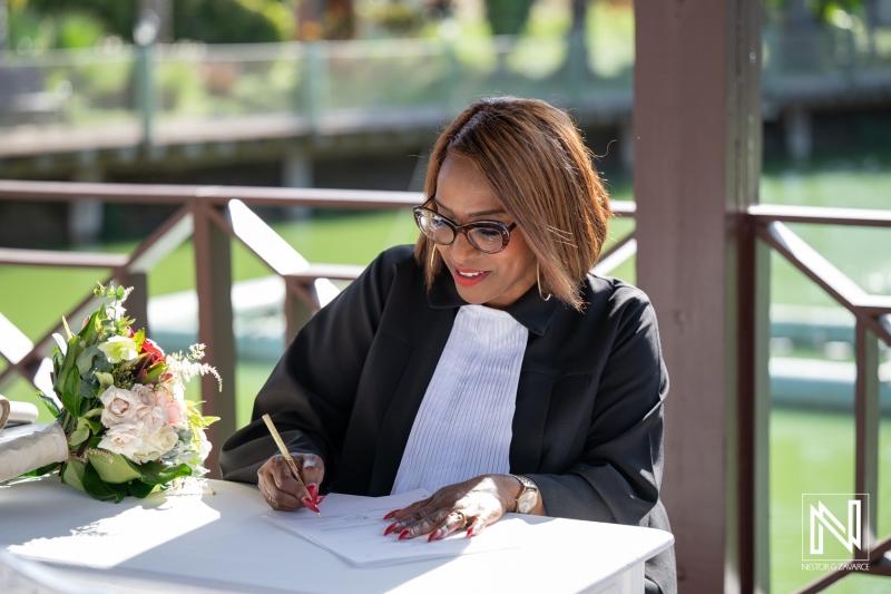Ceremony officiant prepares for a wedding at Acoya Curacao Resort with stunning views of nature