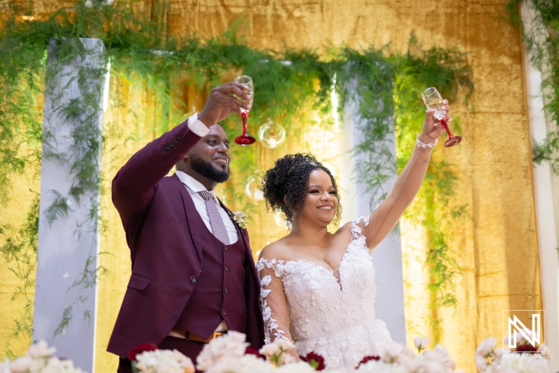 Couple celebrating their wedding at Marjorie's Party Palace in Curacao with heartfelt toasts