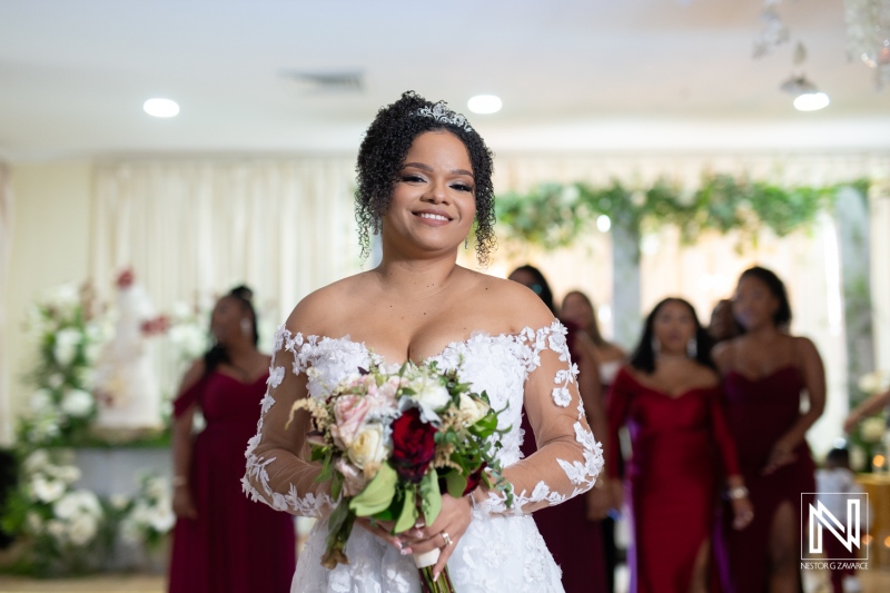 Elegant bride preparing for her wedding celebration at Acoya Curacao Resort surrounded by joyful bridesmaids