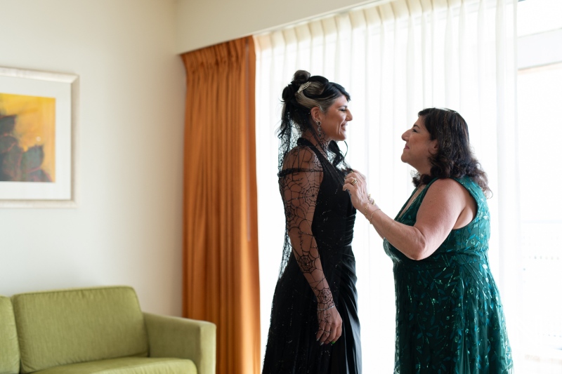 Two women getting ready for a Halloween wedding celebration in Curacao at Sunscape Curacao Resort