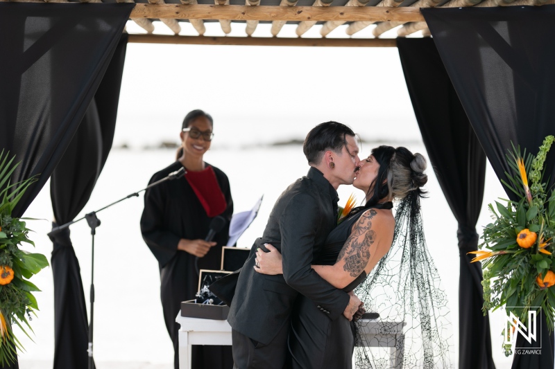 Couple exchanges vows during a beautiful wedding ceremony at Sunscape Curacao Resort on Halloween