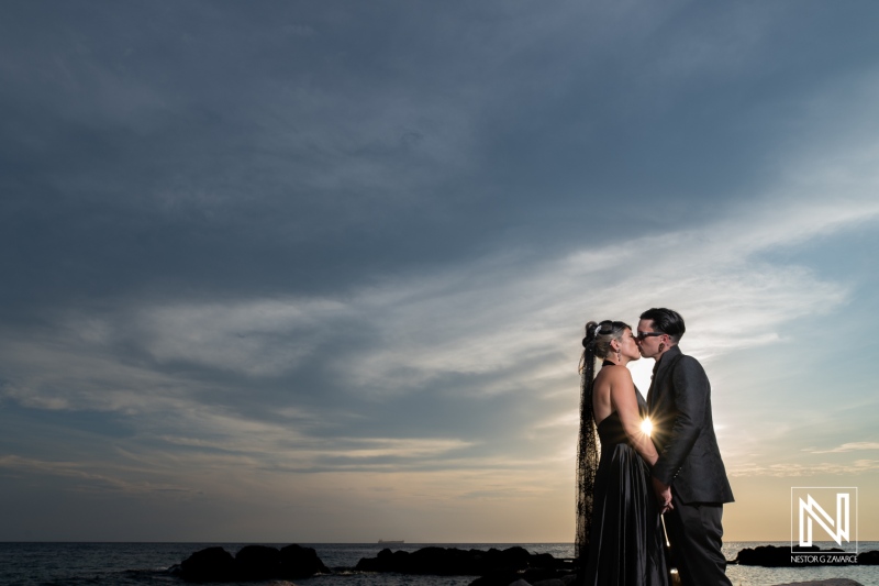 Couple celebrates Halloween wedding at Sunscape Curacao Resort during a sunset ceremony by the beach