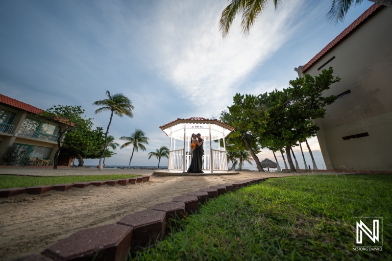 Couple celebrates love in a beautiful outdoor wedding ceremony at Sunscape Curacao Resort during Halloween