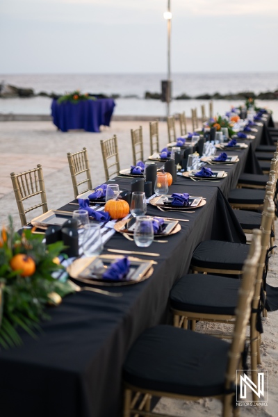 Elegant Halloween wedding setup at Sunscape Curacao Resort by the beach at sunset for a memorable celebration