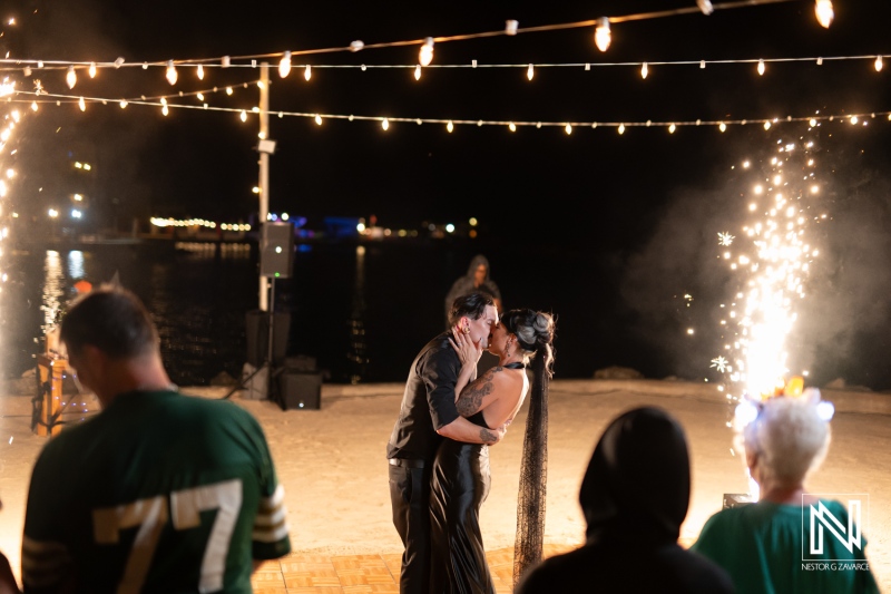 Couple celebrates Halloween wedding at Sunscape Curacao Resort under twinkling lights and fireworks