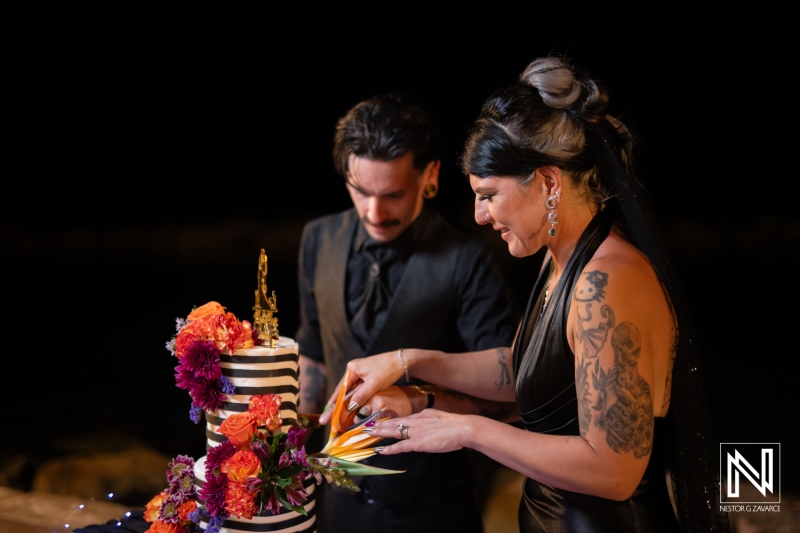 Couple celebrates wedding with Halloween-themed cake cutting at Sunscape Curacao Resort