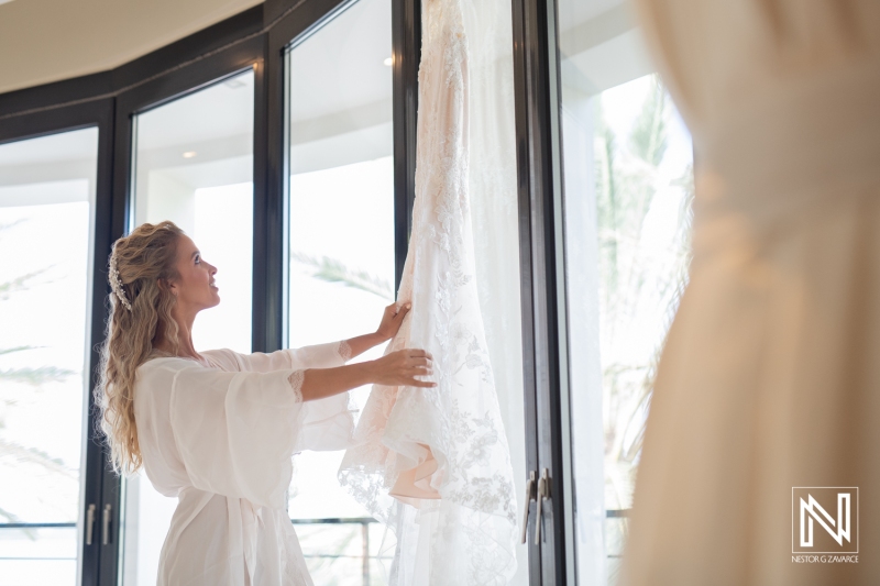 bride looks at her wedding dress