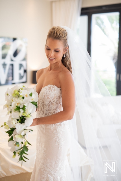 Beautiful bride ready with white orchids bouquet