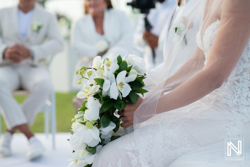 bride with white orchids bouquet