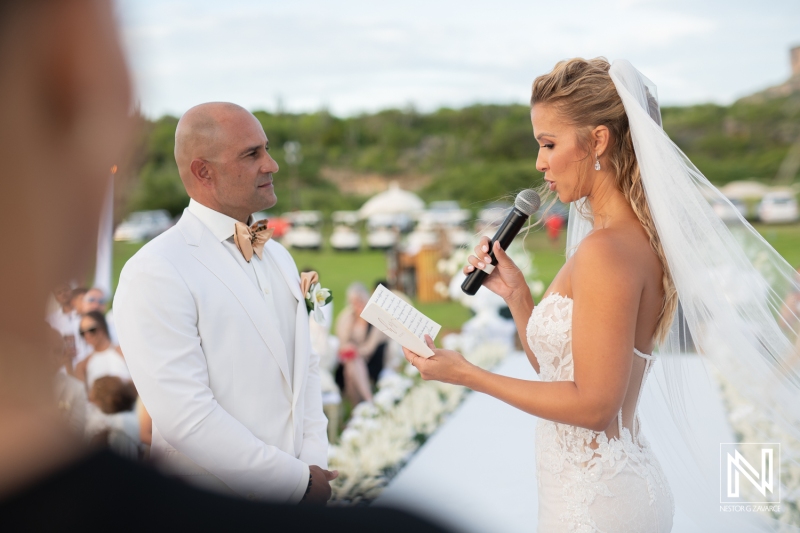 bride reading the wedding vows to the groom