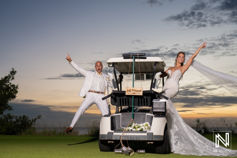 Bride and groom sunset photoshoot at the golf course on a golf cart