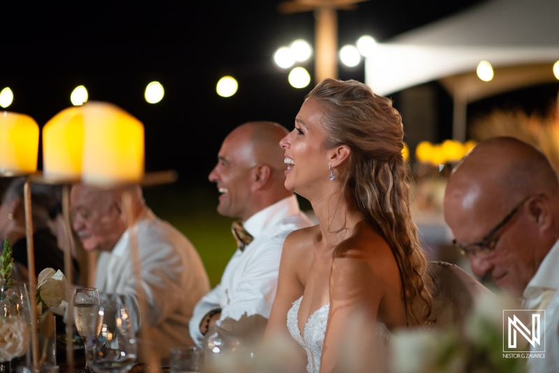 bride and groom reaction to the speech in the wedding dinner