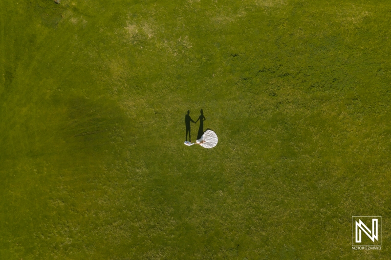 Trash the dress session at golf course. Aerial view