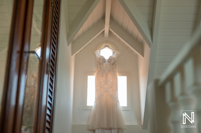 Elegant Wedding Dress Displayed in a Bright, Airy Room With Wooden Accents and a Unique Window Design, Creating a Serene Atmosphere for Special Moments