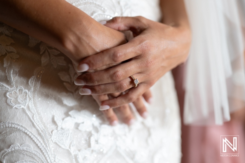 A Close-Up View of a Bride\'s Elegant Hands, Adorned With a Stunning Engagement Ring, as She Prepares for Her Wedding Ceremony Indoors