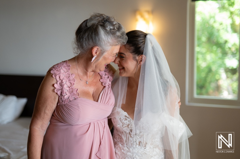 A Joyful Moment Shared Between a Bride and Her Mother During Wedding Preparations in a Bright Room on a Sunny Day