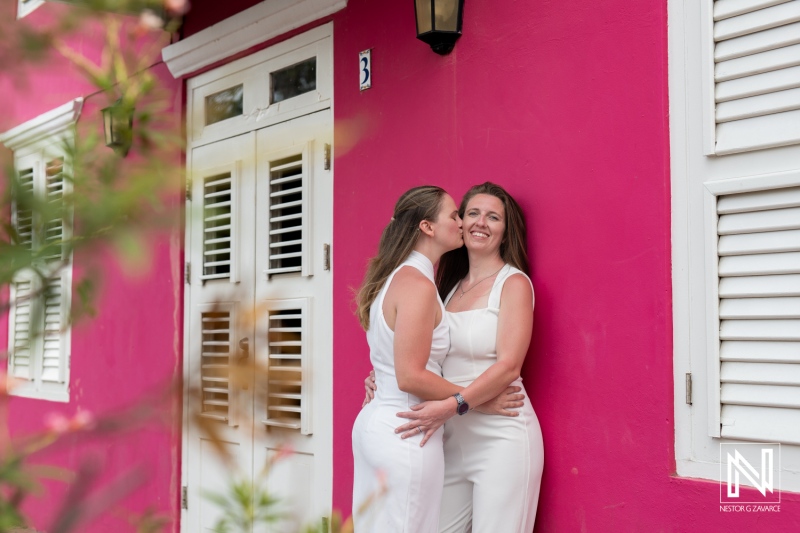 Celebrating love at sunset during an LGBT wedding photoshoot in the vibrant streets of Willemstad, Curacao, capturing heartfelt moments and joy