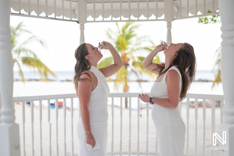 Celebrating love at a sunset wedding in Willemstad, Curacao with an LGBT couple enjoying a joyful moment together