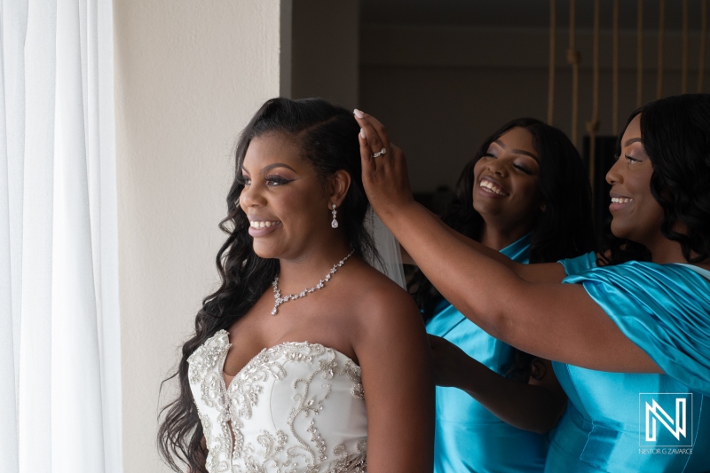 Bride getting into attire